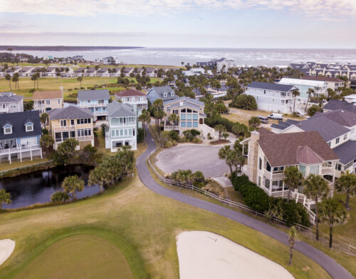 Low aerial view of houses and golf course on Fripp Island, South Carolina.